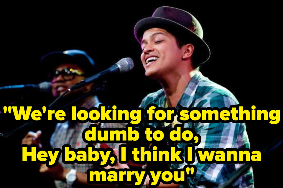 Still from the music video with the lyric: "We're looking for something dumb to do, Hey baby, I think I wanna marry you"