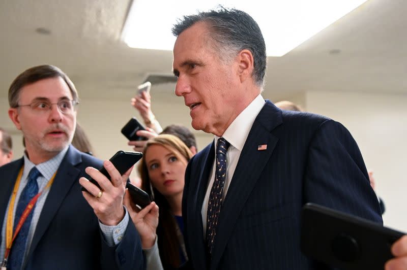 Sen. Romney is pursued by reporters in the Senate subway as he arrives for the fourth day of the Senate impeachment trial of President Trump