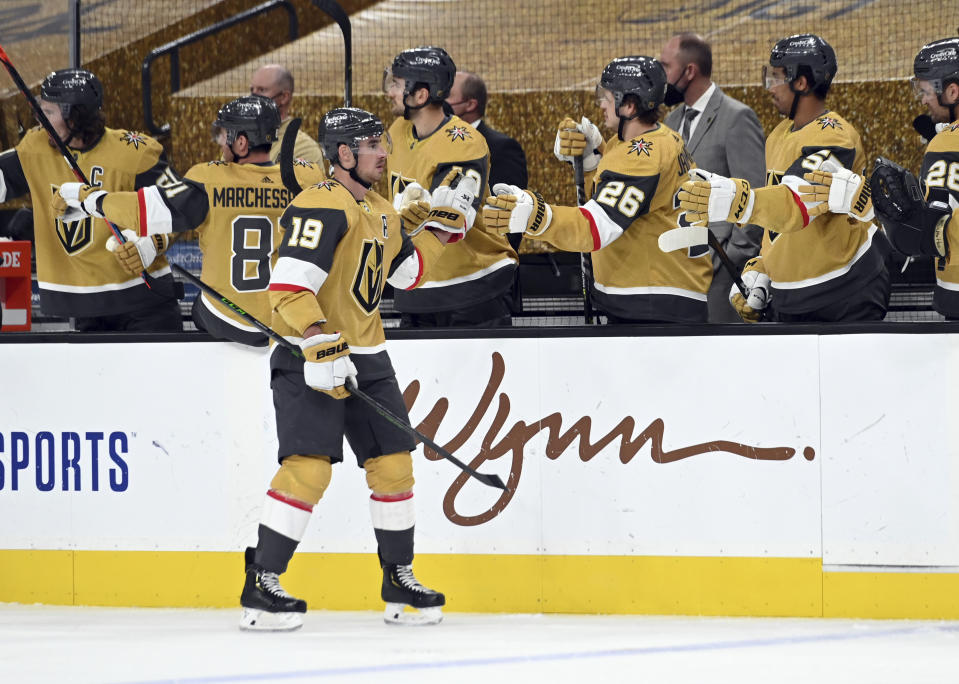 Vegas Golden Knights right wing Reilly Smith (19) celebrates with teammates after a goal against the St. Louis Blues during the third period of an NHL hockey game Saturday, May 8, 2021, in Las Vegas. (AP Photo/David Becker)