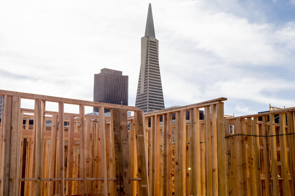 The TransAmerica Pyramid behind the wooden walls of a new structure.