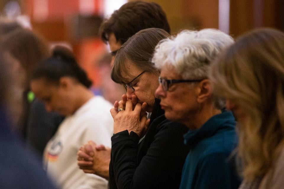 Attendees pray at a "Rally for Life" event on Mar. 2, 2020 at the Iowa State Capitol. Speakers opposed the 2018 Supreme Court decision of the state's constitution that gives Iowa women a fundamental right to abortion. 