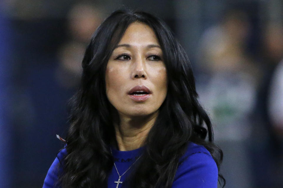 FILE - Buffalo Bills co-owner Kim Pegula stands on the field before an NFL football game, in Arlington, Texas, on Nov. 28, 2019. Pro tennis player Jessica Pegula has revealed that her mother, Buffalo Bills and Sabres co-owner Kim Pegula, went into cardiac arrest in June and is "improving every day" as she deals with significant language and memory issues. (AP Photo/Michael Ainsworth, File)