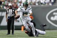 New York Jets quarterback Joe Flacco (19) is sacked by Cincinnati Bengals' Cam Sample (96) during the first half of an NFL football game Sunday, Sept. 25, 2022, in East Rutherford, N.J. (AP Photo/Adam Hunger)