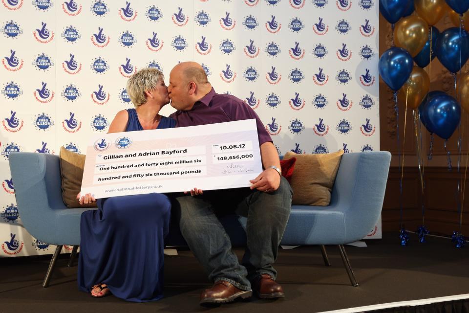 HATFIELD HEATH, ENGLAND - AUGUST 14: Adrian and Gillian Bayford celebrate winning the jackpot of over 148 million GBP in the EuroMillions lottery on August 14, 2012 in Hatfield Heath, England. The couple from Haverhill, Suffolk were the only winners of the Europe-wide lottery whose jackpot had rolled-over 14 times before being won by Mr and Mrs Bayford. (Photo by Oli Scarff/Getty Images)