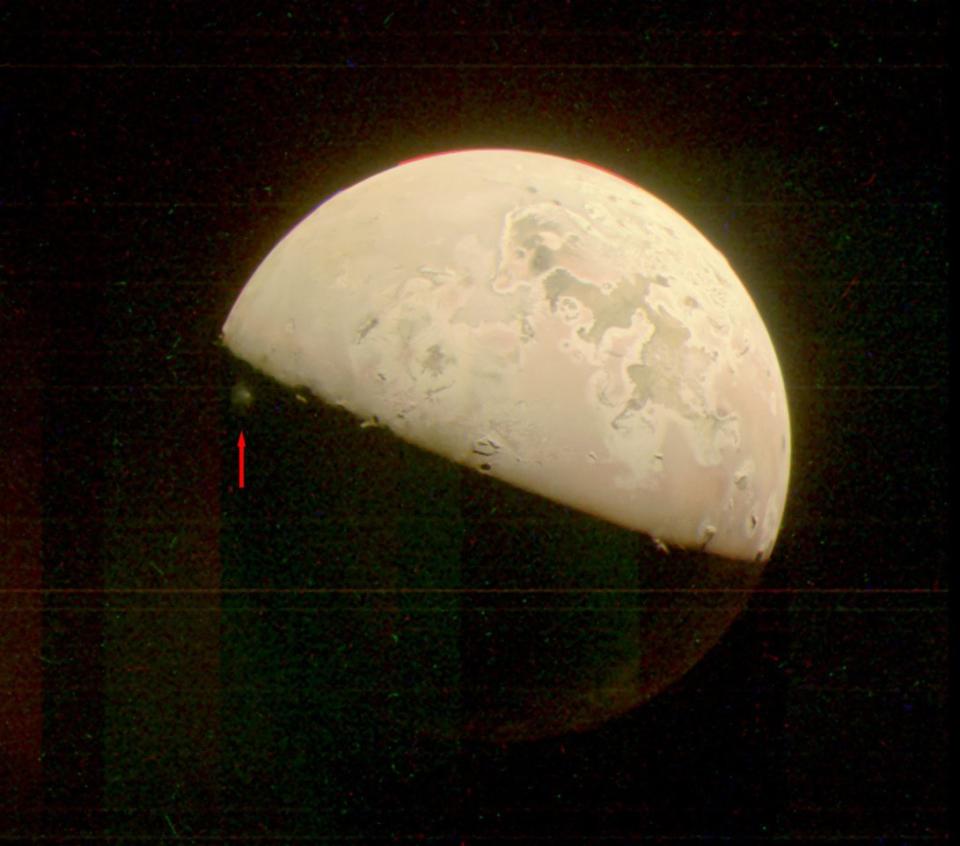 An image of Io taken by Juno shows volcanic material being ejected into the thin atmosphere of the moon Jupiter