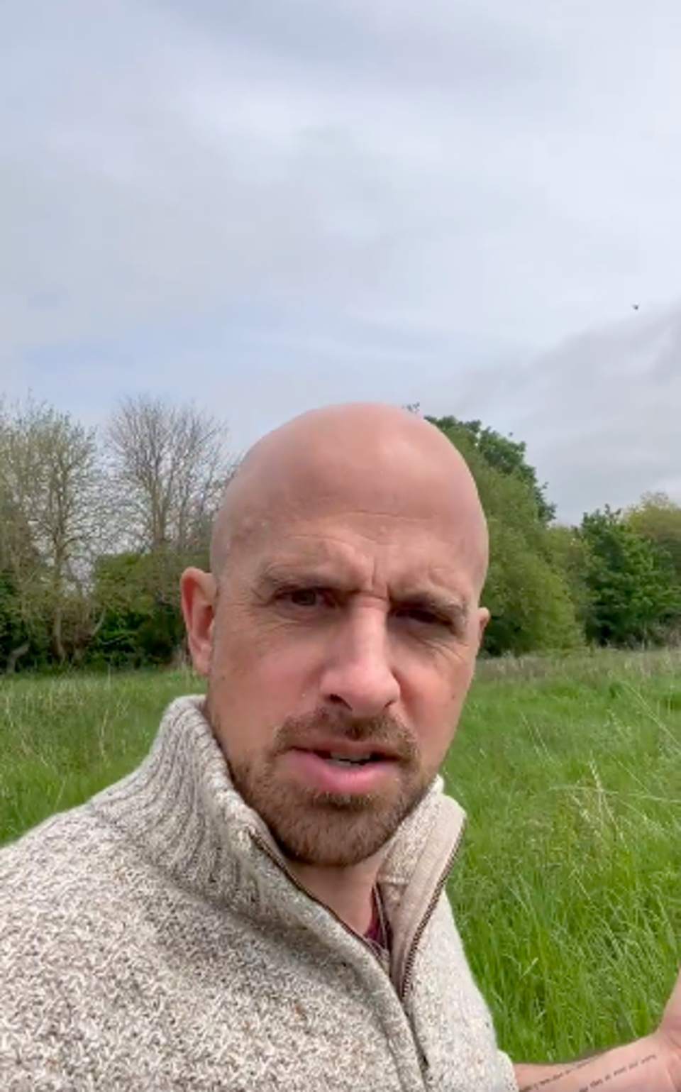 Jonathan Goodwin shares a message from a field while in his wheelchair (Twitter / Jonathan Goodwin)