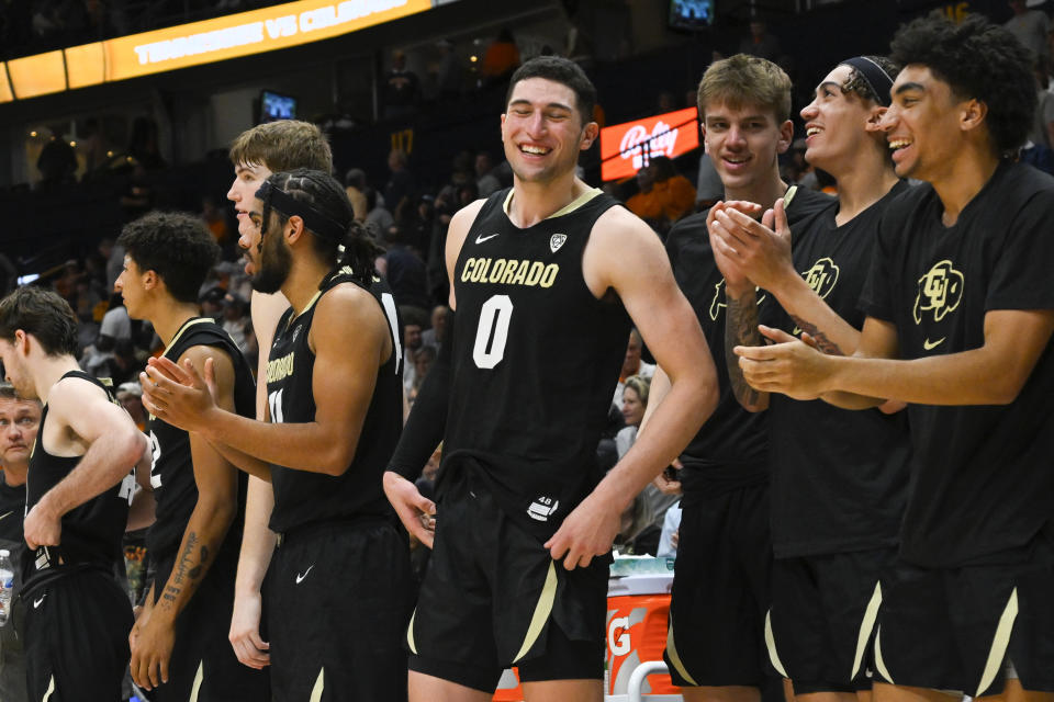 The Colorado bench including guard Luke O'Brien (0) reacts during the second half of an NCAA college basketball game against Tennessee, Sunday, Nov. 13, 2022, in Nashville, Tenn. Colorado won 78-66. (AP Photo/John Amis)