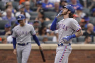 Texas Rangers' Jonah Heim reacts after hitting a solo home run off New York Mets starting pitcher Trevor Williams (29) in the second inning of a baseball game, Saturday, July 2, 2022, in New York. (AP Photo/John Minchillo)