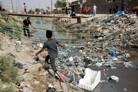 Al-Ashar River, is seen filled with sewage and trash, runs through in the old city of Basra, Iraq September 12, 2018. REUTERS/Alaa al-Marjani/Files