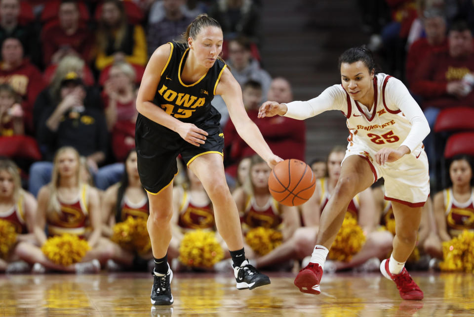 Iowa forward Amanda Ollinger steals the ball from Iowa State forward Kristin Scott during the second half of an NCAA college basketball game, Wednesday, Dec. 11, 2019, in Ames, Iowa. (AP Photo/Charlie Neibergall)