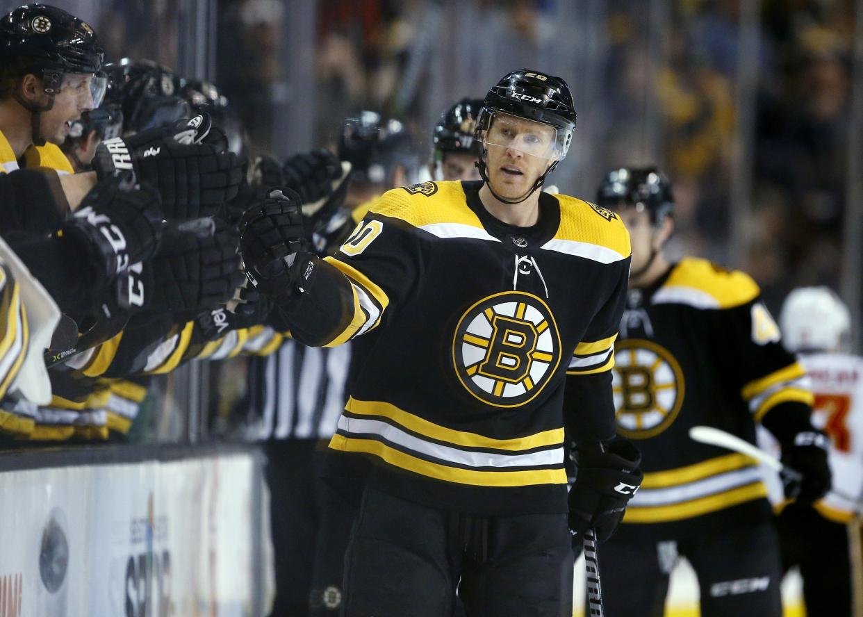 Boston Bruins’ Riley Nash celebrates his goal during a game against the Calgary Flames. (AP Photo/Michael Dwyer)