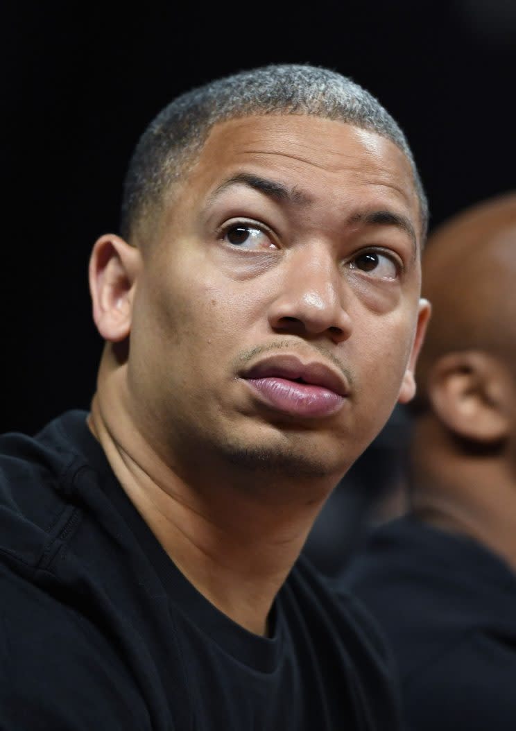 Tyronn Lue looks around to see where the cameras are, and if the coast is clear. (Getty)
