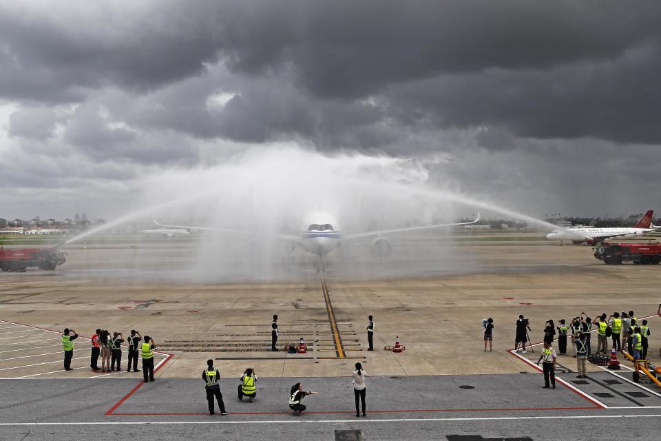 <p>The Airbus A350-900 of Air China is seen during a water salute at Shanghai Hongqiao International Airport on August 14, 2018 in Shanghai, China. The Airbus A350-900 of Air China made its maiden flight from Beijing Capital International Airport to Shanghai Hongqiao International Airport on Tuesday with more than 300 passengers on board. (Photo by Yin Liqin/China News Service/VCG via Getty Images) </p>