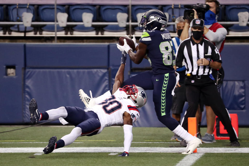 David Moore #83 of the Seattle Seahawks catches a touchdown pass against Jason McCourty #30 of the New England Patriots during the third quarter at CenturyLink Field on September 20, 2020 in Seattle, Washington. (Photo by Abbie Parr/Getty Images)