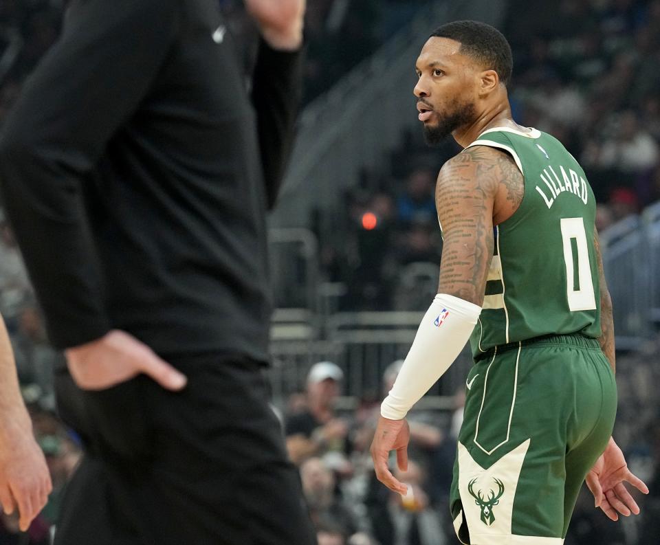 Milwaukee Bucks guard Damian Lillard (0) glares at the Indiana Pacers bench after scoring a drawing a foul during the first half of their first round playoff game Sunday, April 21, 2024, at Fiserv Forum in Milwaukee, Wisconsin.