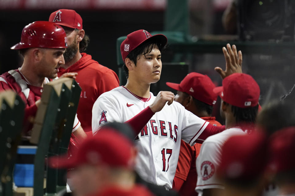 Los Angeles Angels starting pitcher Shohei Ohtani (17) returns to the dugout after pitching during the seventh inning of a baseball game against the Texas Rangers Friday, Sep. 3, 2021, in Anaheim, Calif. (AP Photo/Ashley Landis)