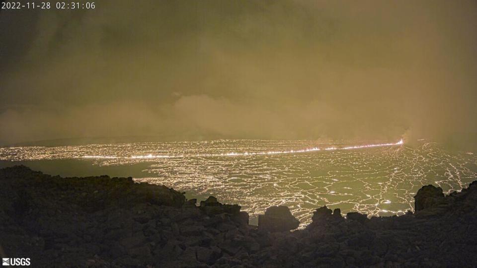 This image provided by the USGS Hawaiian Volcano Observatory shows a view from a research camera on the north rim of the summit caldera of the Mauna Loa volcano, Monday, Nov. 28, 2022. The U.S. Geological Survey says the eruption began late Sunday night in the summit caldera of the volcano on the Big Island. Early Monday it said lava flows were contained within the summit area and weren’t threatening nearby communities. (USGS Hawaiian Volcano Observatory via AP)