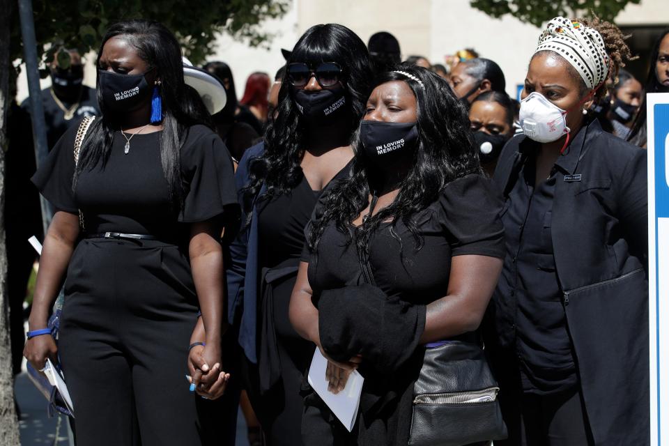 Relatives huddle outside the site of a funeral for Robert Fuller on Tuesday, June 30, 2020, in Littlerock, Calif. Fuller, a 24-year-old Black man, was found hanging from a tree in a park in a Southern California high desert city. Authorities initially said the death of Fuller appeared to be a suicide but protests led to further investigation, which continues.