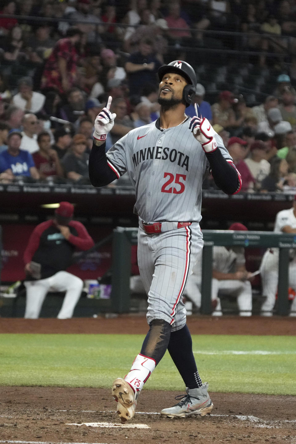 Minnesota Twins' Byron Buxton reacts after hitting a three-run home run against the Arizona Diamondbacks in the fourth inning during a baseball game, Thursday, June 27, 2024, in Phoenix. (AP Photo/Rick Scuteri)