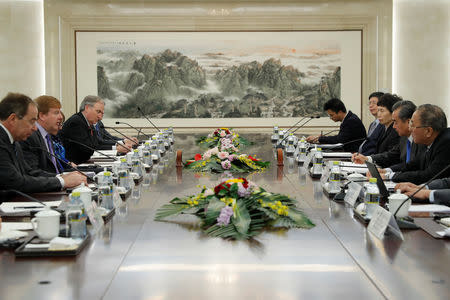 Myron Brilliant, executive vice president and head of International Affairs at the U.S. Chamber of Commerce (2-L) and Chinese State Councilor and Foreign Minister Wang Yi (2-R) attend a meeting at the Ministry of Foreign Affairs in Beijing, China February 19, 2019. Wu Hong/Pool via REUTERS