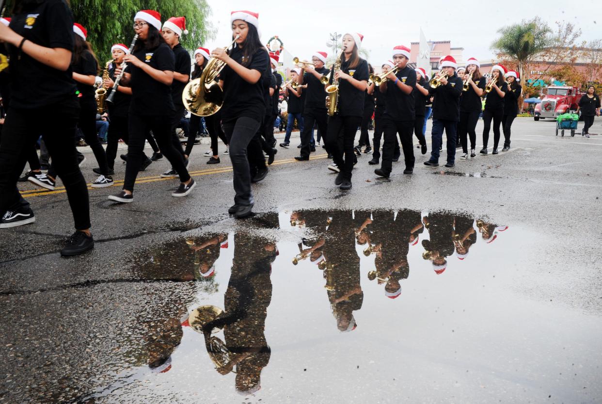 Students march in the 2019 Oxnard Christmas parade. This year's event is set for Saturday.