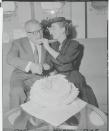 <p>The actress and businessman taste a celebratory cake, while aboard the S.S. United States on their way to Europe for their honeymoon.</p>