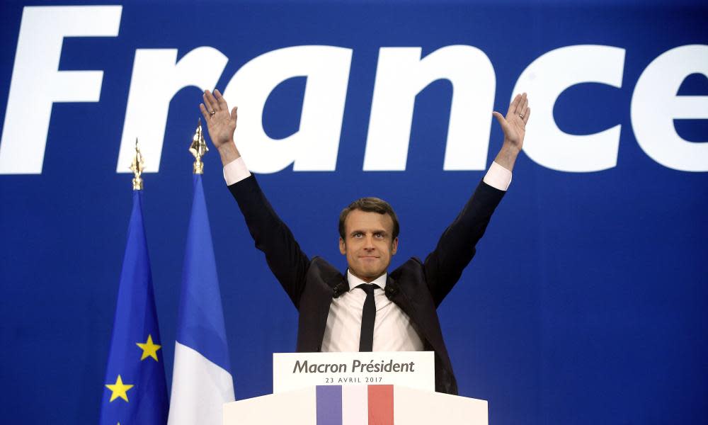 French centrist presidential candidate Emmanuel Macron waves before addressing his supporters at his election day headquarters in Paris.