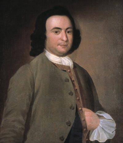 A man in formal 18th century dress.