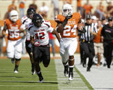 AUSTIN, TX - NOVEMBER 5: Running back Joe Bergeron #24 of the Texas Longhorns makes a second quarter long run down the sidelines against safety D. J. Johnson #12 of the Texas Tech Red Raiders on November 5, 2011 at Darrell K. Royal-Texas Memorial Stadium in Austin, Texas. (Photo by Erich Schlegel/Getty Images)