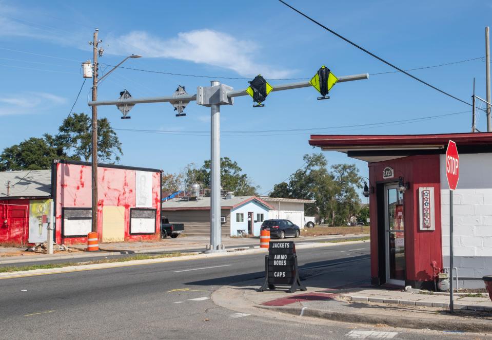 Crosswalk signs are being installed as at part of the Florida Department of Transportation's West Cervantes Street Pedestrian Safety Project in Pensacola on Wednesday, Nov. 10, 2021.