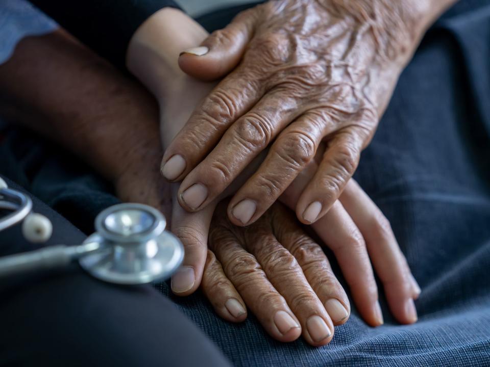 dementia patient holding hands