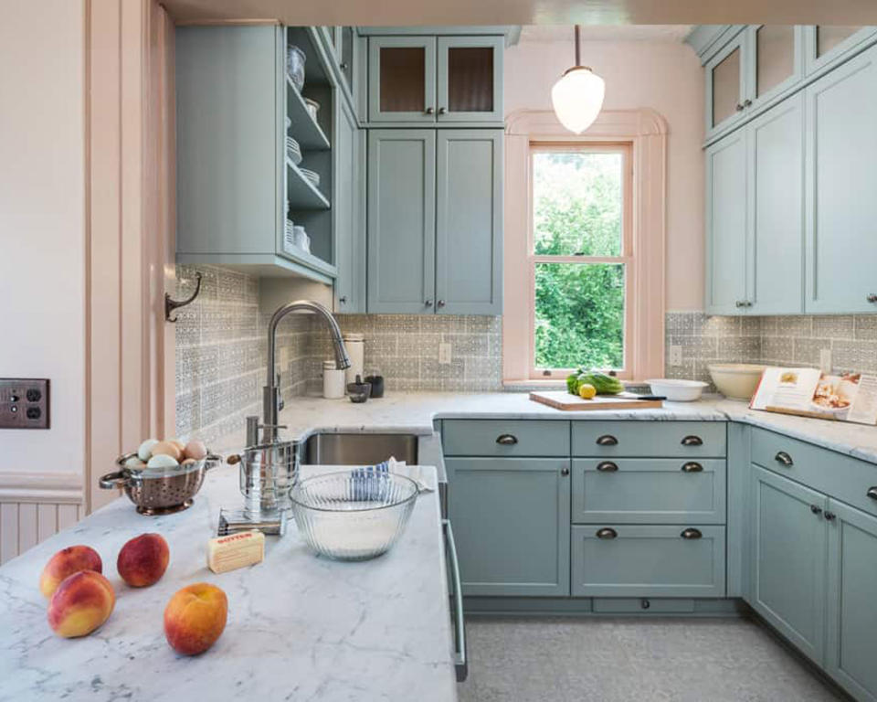 7. Melt your small U-shaped kitchen into your living space with an ice cream pastel palette