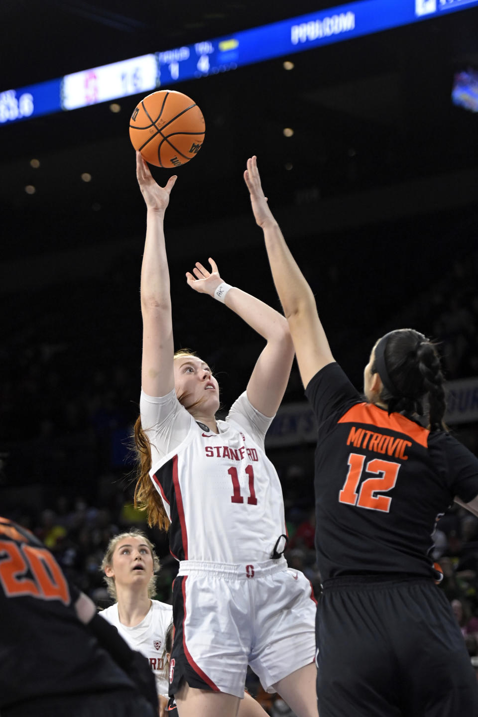 Stanford forward Ashten Prechtel (11) shoots over Oregon State forward Jelena Mitrovic (12) during an NCAA college basketball game in the quarterfinals of the Pac-12 women's tournament Thursday, March 3, 2022, in Las Vegas. (AP Photo/David Becker)