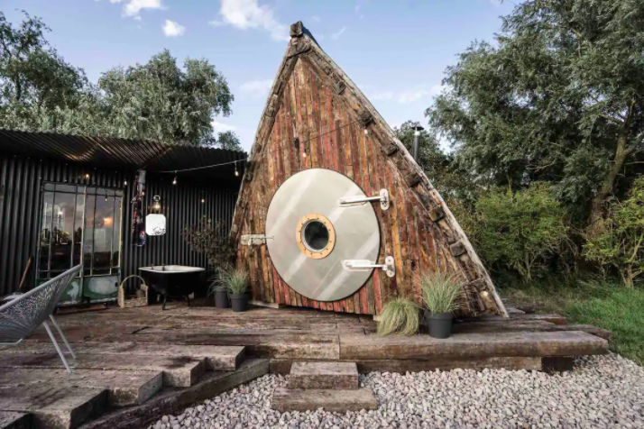 <p>We love this eco-friendly Airbnb, which is a converted 1945 boat (it originally sailed out of Penzance in Cornwall). Enclosed within a private three-acre forest, this <a href="https://www.housebeautiful.com/uk/lifestyle/property/" rel="nofollow noopener" target="_blank" data-ylk="slk:property;elm:context_link;itc:0;sec:content-canvas" class="link ">property</a> is nestled within its own pocket of nature. With an outdoor bath, roaring fireplace and a deeply charming facade, it truly couldn't provide a more comforting stay. </p><p><a class="link " href="https://airbnb.pvxt.net/ORr2VA" rel="nofollow noopener" target="_blank" data-ylk="slk:BOOK NOW;elm:context_link;itc:0;sec:content-canvas">BOOK NOW</a><br></p>