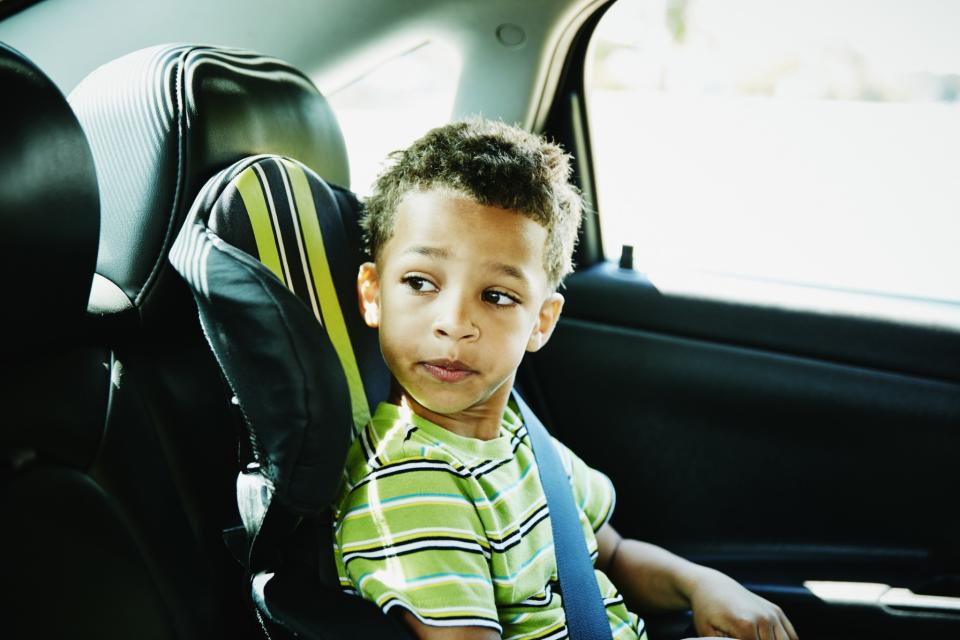 Boy looking out of car window