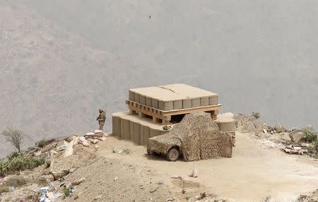 A Saudi soldier takes his position at Saudi Arabia's border with Yemen, April 6, 2015. REUTERS/Faisal Al Nasser