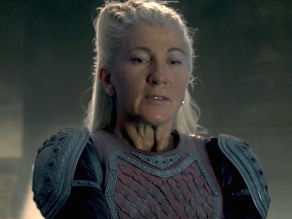 Eve Best as Rhaenys Targaryen looking down.