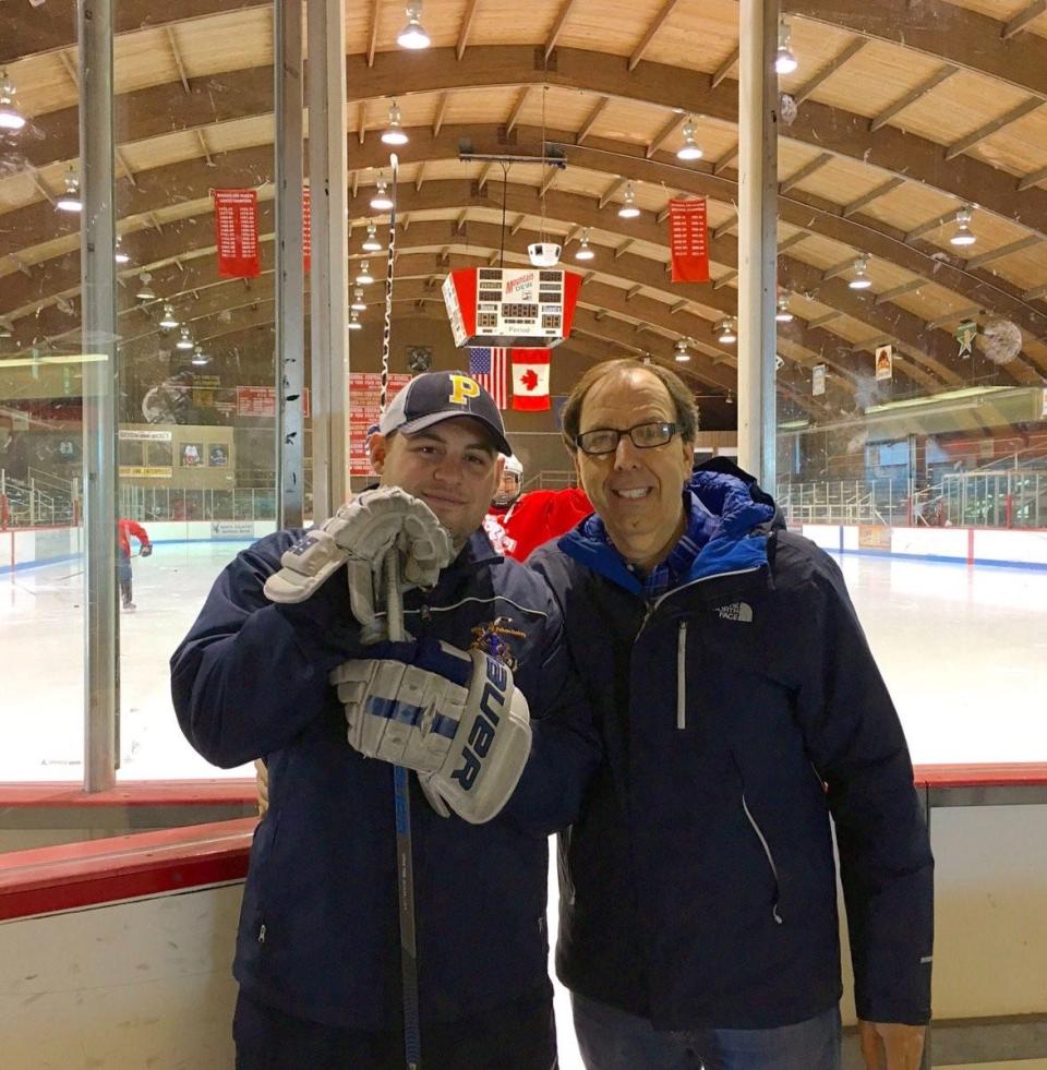 Then-assistant Pelham High ice hockey coach Michael Cambria (l) with then-head coach Ed Witz. Cambria has replaced Witz as head coach following Witz's decision to retire after 38 seasons and two state championships, the latest coming in March.