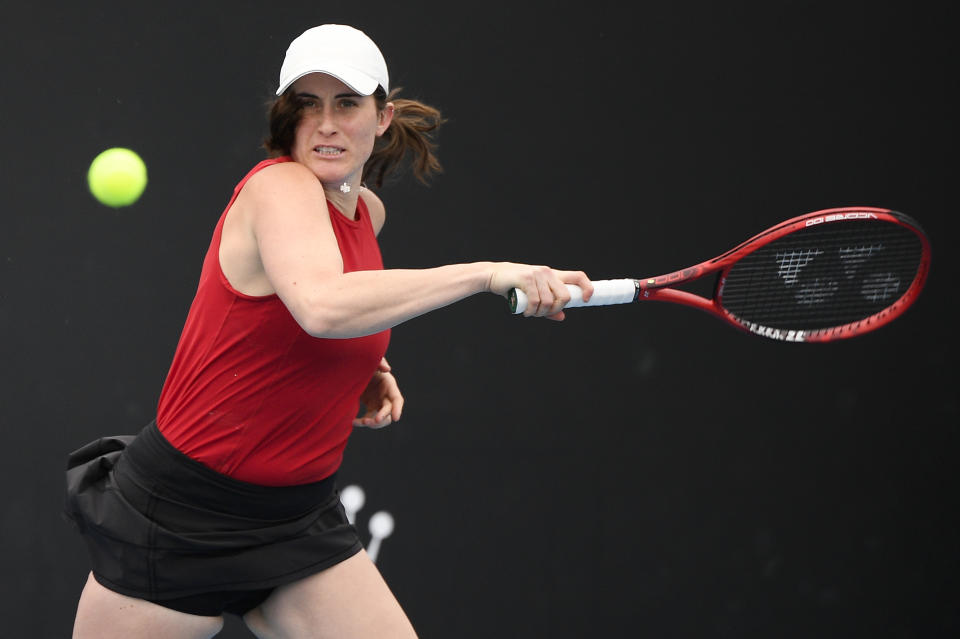 Canada's Rebecca Marino makes a forehand return to Australia's Kimberly Birrell during their first round match at the Australian Open tennis championship in Melbourne, Australia, Monday, Feb. 8, 2021.(AP Photo/Andy Brownbill)
