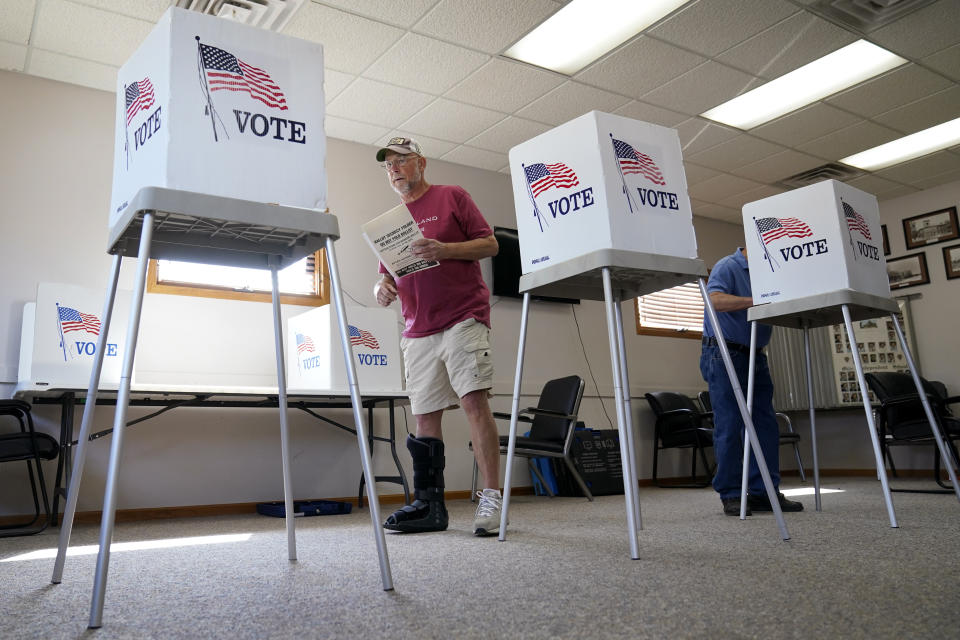 Jim Wooley, of rural Indianola, Iowa, prepares to cast his ballot in a special election for Warren County Auditor, Tuesday, Aug. 29, 2023, in Milo, Iowa. (AP Photo/Charlie Neibergall)