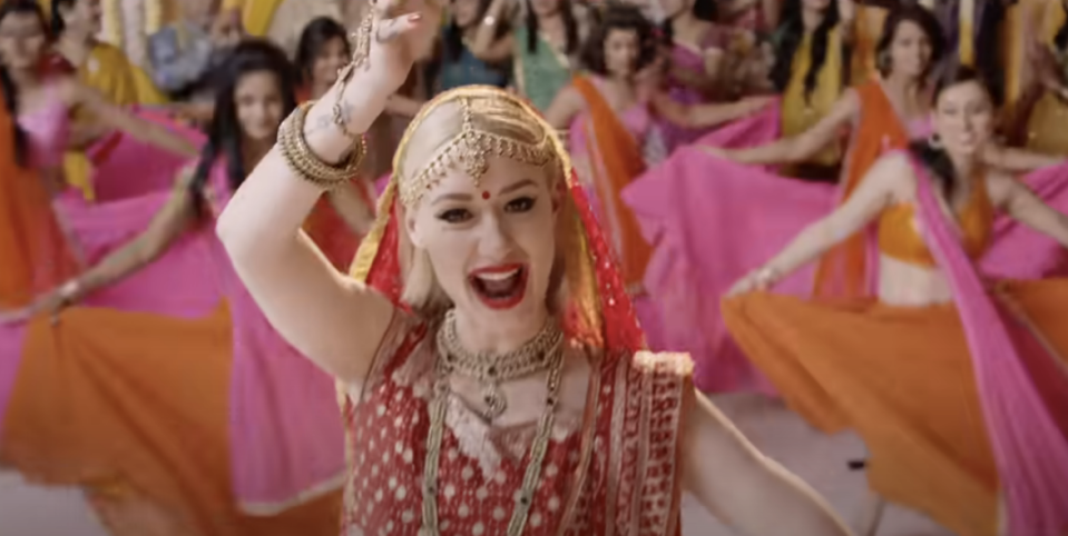 Azalea in a bindi and sari in the music video