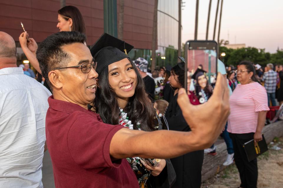 Families celebrate and take photos after the Delta College graduation ceremony held in the Stockton Arena May 18, 2023.