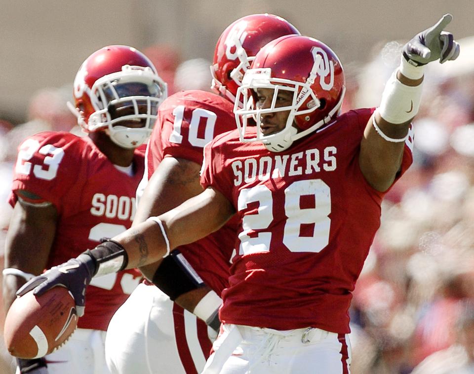 OU defensive back Antonio Perkins (28) celebrates after recovering a Texas Tech fumble on Oct. 2, 2004.