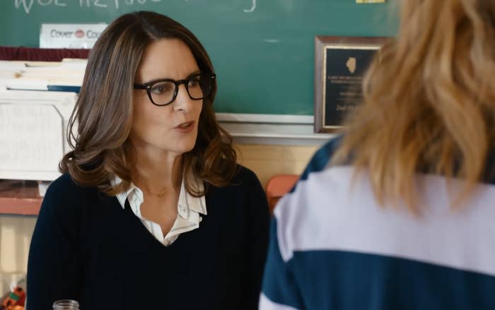 Tina Fey portraying a teacher speaking to a student in a classroom scene