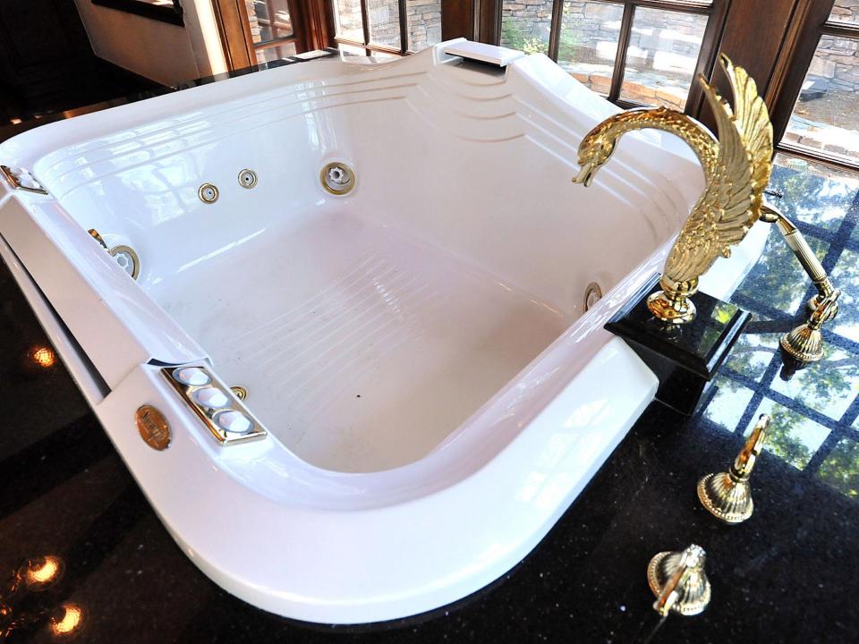 <p>The bathtub in the master bathroom of Neverland’s main house</p>Rex Features