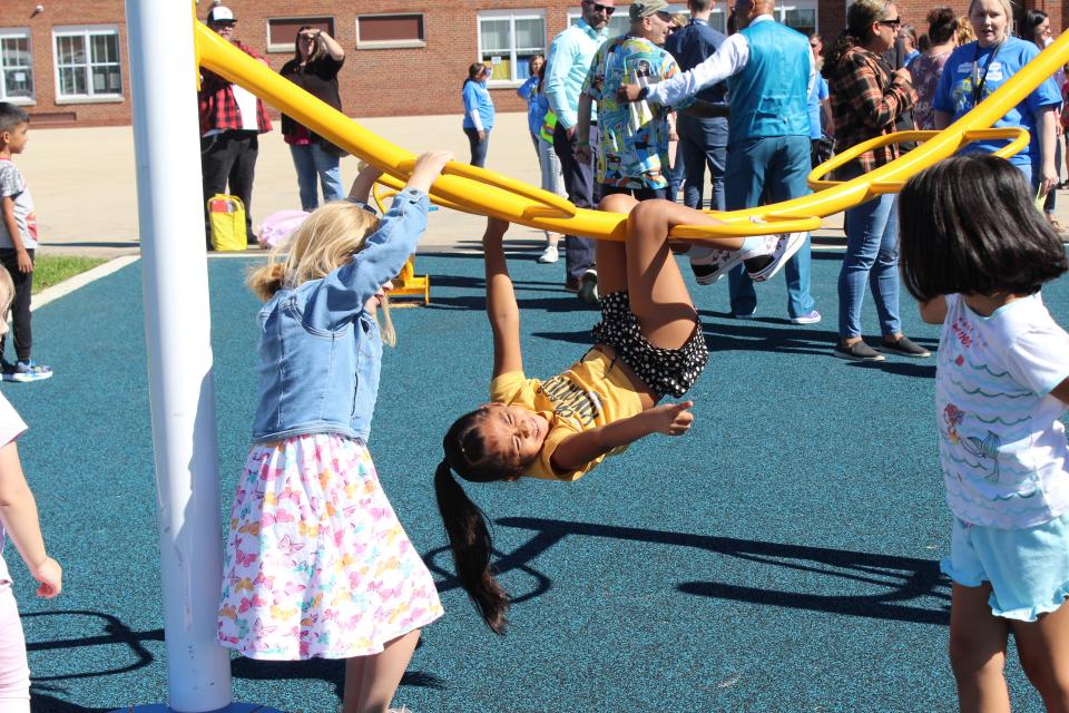 Kids play on Jackson Elementary's new accessible playground on Aug. 30.