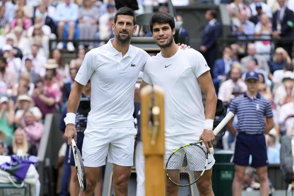 FILE - Serbia's Novak Djokovic, left, and Spain's Carlos Alcaraz pose for a photo ahead of the final of the men's singles on day fourteen of the Wimbledon tennis championships in London, Sunday, July 16, 2023. Tennis is in a state of transition as the U.S. Open is set to begin on Aug. 28. (AP Photo/Kirsty Wigglesworth, File)