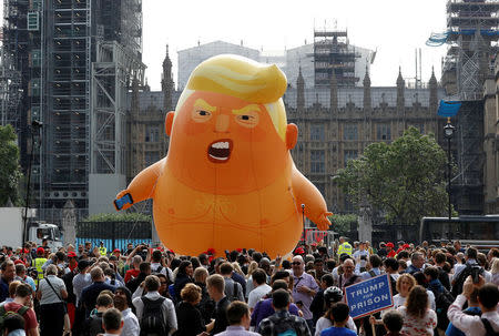 Demonstrators fly a blimp portraying U.S. President Donald Trump, in Parliament Square, during the visit by Trump and First Lady Melania Trump in London. REUTERS/Peter Nicholls