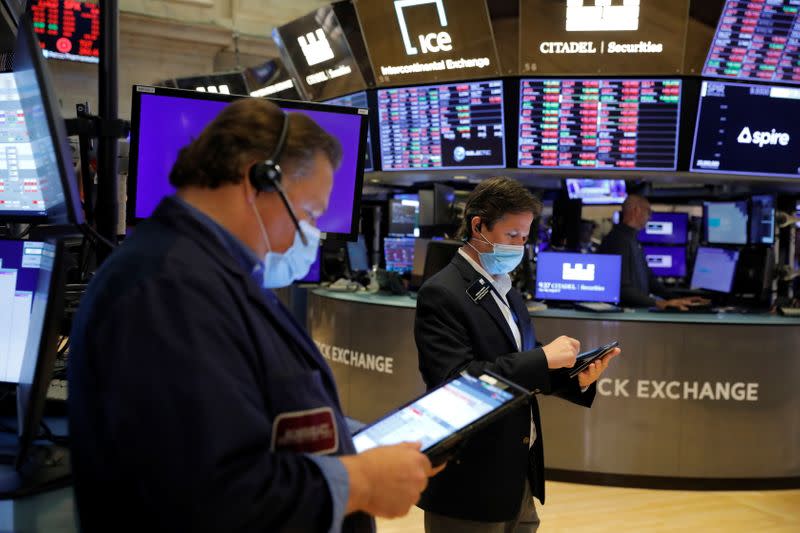 Traders work on the trading floor of the New York Stock Exchange (NYSE) in Manhattan, New York City