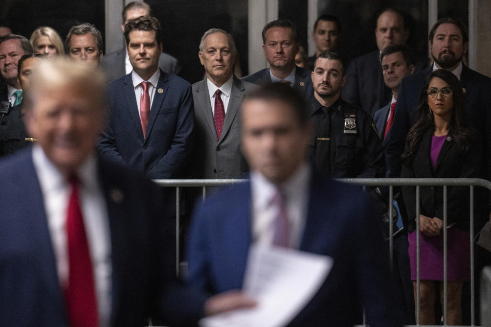 Rep. Matt Gaetz, R-Fla., center, and Rep. Lauren Boebert, a R-Colo., right, look on as former President Donald Trump speaks to the media at Manhattan criminal court in New York, on Thursday, May 16, 2024. (Jeenah Moon/Pool Photo via AP)
